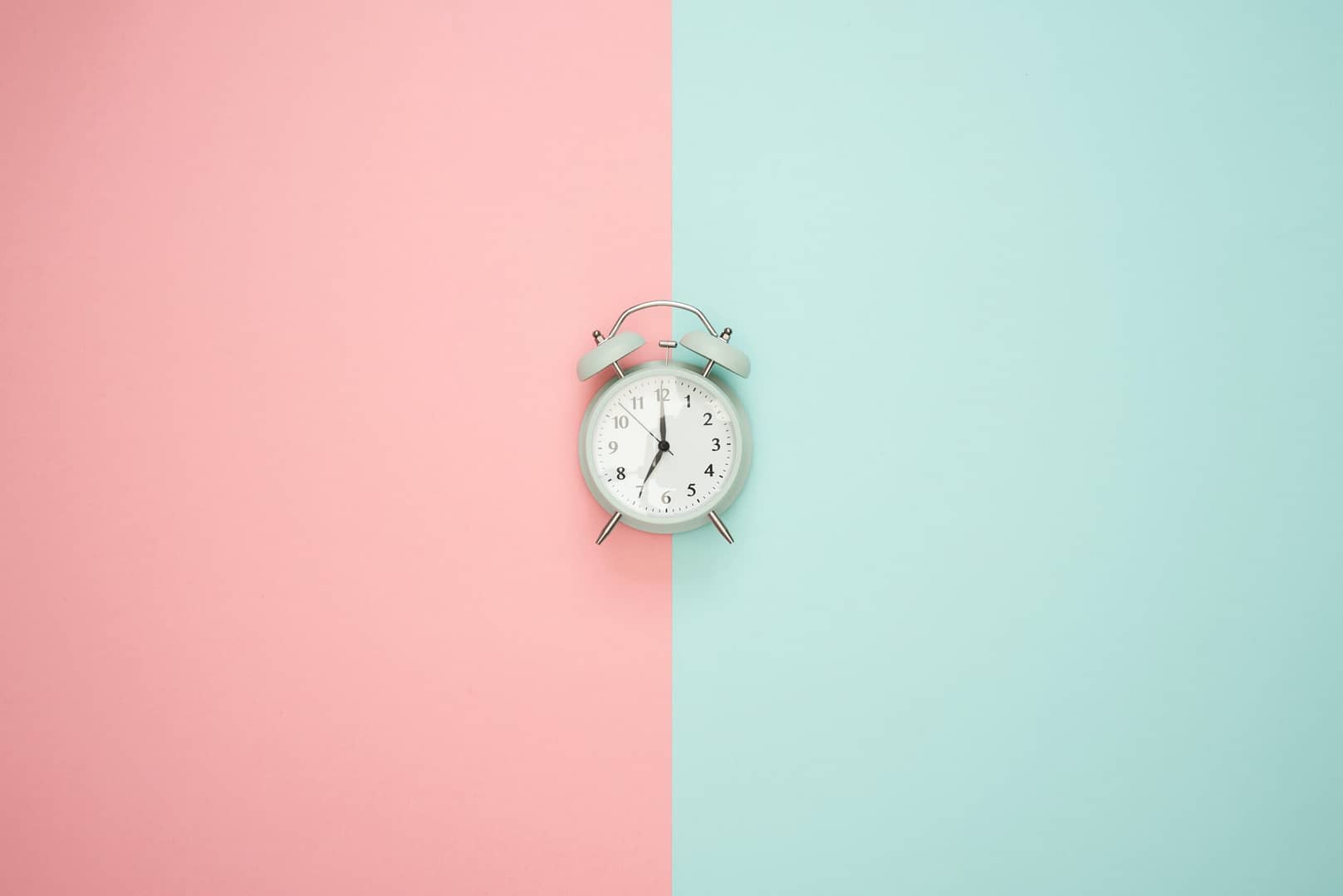 A clock split between two different colors.